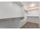 Spacious walk-in closet with built-in shelving and ample storage space at 5440 W Apollo Rd, Laveen, AZ 85339