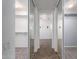 View of a walk-in closet featuring mirrored sliding doors that amplify the space, providing abundant storage and a stylish look at 5440 W Apollo Rd, Laveen, AZ 85339