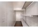 This walk-in closet boasts built-in shelving and ample space for all your storage needs, keeping your belongings organized at 5440 W Apollo Rd, Laveen, AZ 85339