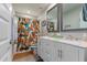 Bathroom featuring a double vanity with a tile floor and colorful shower curtain at 5702 S Beck Ave, Tempe, AZ 85283