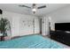 Bright bedroom with a ceiling fan, ensuite bathroom, and lots of natural light at 5702 S Beck Ave, Tempe, AZ 85283