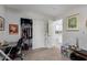 Cozy bedroom with a closet, artwork, and doorway to the kitchen at 5702 S Beck Ave, Tempe, AZ 85283