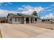 Charming home featuring a xeriscaped front yard, solar panels, and an inviting, arched entryway at 5702 S Beck Ave, Tempe, AZ 85283