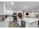 Modern kitchen boasting new cabinets, stainless appliances, and a convenient breakfast bar at 5702 S Beck Ave, Tempe, AZ 85283