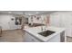 Modern kitchen with white countertops, stainless steel faucet, and easy access to the living area at 5702 S Beck Ave, Tempe, AZ 85283