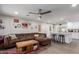 Open-concept living room with a comfortable sofa that transitions into the kitchen area at 5702 S Beck Ave, Tempe, AZ 85283