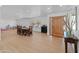 Bright entryway featuring a wooden door, a table, and smooth floors at 5711 E Corrine Dr, Scottsdale, AZ 85254
