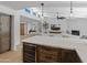 Open kitchen featuring a wine fridge, modern lighting, and an open floor plan at 5711 E Corrine Dr, Scottsdale, AZ 85254