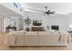 Beautiful living room with modern lighting, a TV, and a neutral color palette at 5711 E Corrine Dr, Scottsdale, AZ 85254