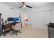 Bright office with modern desk, chair, computer, and built-in shelving at 5711 E Corrine Dr, Scottsdale, AZ 85254