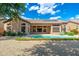 Exterior of home featuring a pool and gravel backyard with nice landscaping and solar panels at 6135 E Campo Bello Dr, Scottsdale, AZ 85254