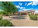 A charming gravel backyard featuring lush trees and a sparkling pool, creating a serene outdoor retreat at 6135 E Campo Bello Dr, Scottsdale, AZ 85254