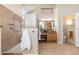 Bathroom with a step-in shower, vanity area, granite countertop and natural-toned tile flooring at 6135 E Campo Bello Dr, Scottsdale, AZ 85254