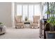 Comfortable sitting area with beige armchairs and plantation shutters for ample natural light at 6135 E Campo Bello Dr, Scottsdale, AZ 85254