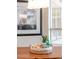 Dining room table with a decorative wicker basket and picture at 6135 E Campo Bello Dr, Scottsdale, AZ 85254