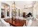 Elegant dining room with a modern chandelier and view into the living spaces at 6135 E Campo Bello Dr, Scottsdale, AZ 85254