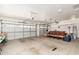 Spacious three car garage with two garage door openers and plenty of room for storage and chairs at 6135 E Campo Bello Dr, Scottsdale, AZ 85254
