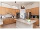 Well-lit kitchen with gas stove, granite counters, stainless steel appliances, and plenty of storage space at 6135 E Campo Bello Dr, Scottsdale, AZ 85254