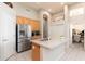 Bright kitchen with stainless steel appliances and a view into the dining room at 6135 E Campo Bello Dr, Scottsdale, AZ 85254