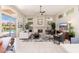 Spacious open concept living room with neutral colors, a fireplace, and backyard views at 6135 E Campo Bello Dr, Scottsdale, AZ 85254