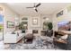Living room features tile flooring, a fireplace, and lots of natural light at 6135 E Campo Bello Dr, Scottsdale, AZ 85254