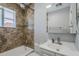 Bathroom featuring a shower-tub combo, modern vanity, and updated fixtures at 618 N Stapley Dr, Mesa, AZ 85203