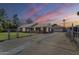 Charming single-story brick home featuring a secure fenced yard and long driveway at 618 N Stapley Dr, Mesa, AZ 85203