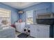 Bright laundry room with utility sink, cabinetry, counterspace, and natural light at 618 N Stapley Dr, Mesa, AZ 85203