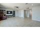 Bright living room with tile flooring, ceiling fan, and ample space for entertaining at 618 N Stapley Dr, Mesa, AZ 85203