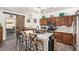 Well-equipped kitchen showcasing granite countertops, stainless steel appliances, and an island with bar seating at 630 E Racine Pl, Casa Grande, AZ 85122