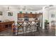 Well-equipped kitchen featuring wooden cabinets, stainless steel appliances, and a kitchen island with seating at 630 E Racine Pl, Casa Grande, AZ 85122