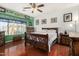 Spacious main bedroom with wood floors, rustic furniture, and decorative artwork throughout at 630 E Racine Pl, Casa Grande, AZ 85122