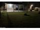 Spacious backyard with lush lawn, covered patio, and mature landscaping, ideal for relaxation at 6725 W Cypress St, Phoenix, AZ 85035