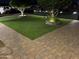 Exquisite front yard showcasing pavers, artificial turf, and meticulously maintained landscaping at 6725 W Cypress St, Phoenix, AZ 85035