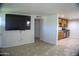 Open concept living room showing tile floors and kitchen at 6725 W Cypress St, Phoenix, AZ 85035