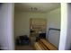 Unfinished storage area featuring tile flooring and built-in shelves at 6725 W Cypress St, Phoenix, AZ 85035