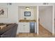Conveniently located bar with built-in wine refrigerator, ideal for entertaining guests at 7469 E Timberlane Ct, Scottsdale, AZ 85258