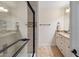 Bathroom showcasing a glass-enclosed shower with detailed tile work and granite counters at 7469 E Timberlane Ct, Scottsdale, AZ 85258