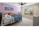bedroom with a window view, ceiling fan, and plenty of plushy friends on the bed at 7469 E Timberlane Ct, Scottsdale, AZ 85258