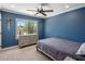 Bedroom with natural light and views, with a grey dresser and matching bedding at 7469 E Timberlane Ct, Scottsdale, AZ 85258