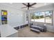 Bonus room with a large window view, modular seating, and organized storage at 7469 E Timberlane Ct, Scottsdale, AZ 85258
