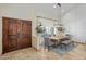 Dining room showcasing double door entry, stylish lighting, and seating for Gathering gatherings at 7469 E Timberlane Ct, Scottsdale, AZ 85258