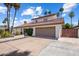 Attractive two-story home featuring a tile roof, and a spacious driveway at 7469 E Timberlane Ct, Scottsdale, AZ 85258