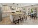 Bright kitchen featuring granite countertops, modern appliances, and convenient breakfast bar seating at 7469 E Timberlane Ct, Scottsdale, AZ 85258