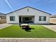 A beautiful backyard with desert landscaping and a covered patio at 8024 W State Ave, Glendale, AZ 85303