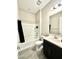 Cozy bathroom showcasing a shower-tub combination, toilet, and vanity with mirror at 8024 W State Ave, Glendale, AZ 85303