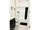 Bright bathroom featuring modern vanity and shower-tub combo with black shower curtain at 8024 W State Ave, Glendale, AZ 85303