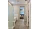 Bathroom with shower, tub and view into the bedroom area at 8024 W State Ave, Glendale, AZ 85303