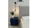 Contemporary bedroom detail with bedside table, stylish lamp and upholstered headboard at 8024 W State Ave, Glendale, AZ 85303