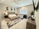 Calming bedroom with neutral tones, plush rug, and large window at 8024 W State Ave, Glendale, AZ 85303
